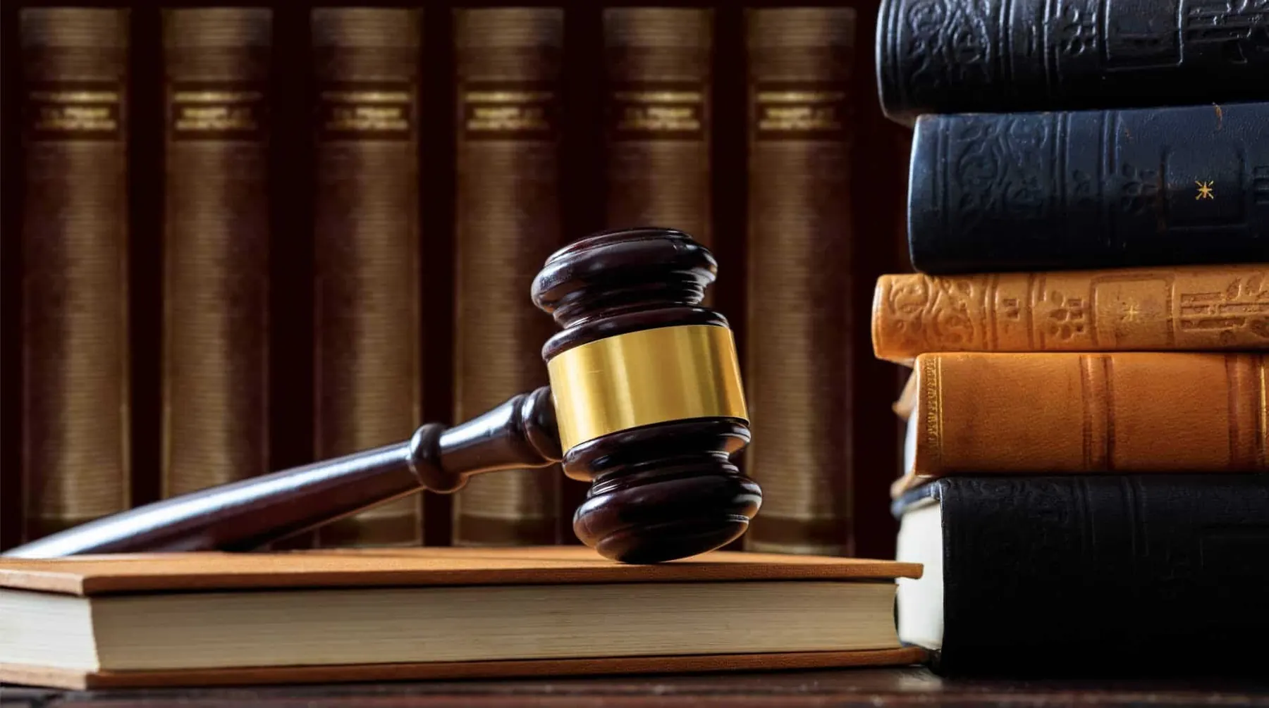 Gavel resting on law books in the firm's office